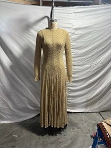 Detail of the unique mesh texture and ribbed fabric on this slim fit long sleeve maxi dress