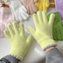Close-up of soft green plush gloves for kids with colorful striped cuffs and multi-color options
