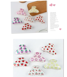 Close-up of hair claw clips with various fruit prints and pearlescent finish
