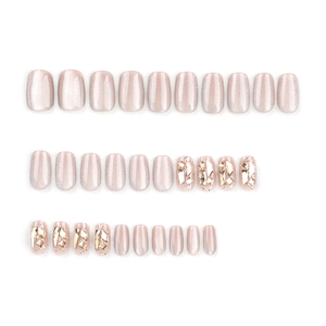 Pink cat eye press-on nails with diamond accents and shimmering glitter finish