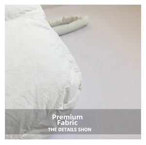 Close-up of pearl white quilted soft fabric texture for trendy crossbody bag design