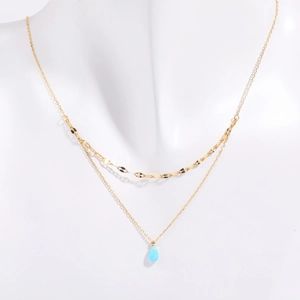 Double layer 18K gold plated necklace with blue teardrop opal pendant on model