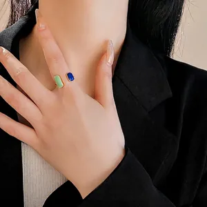 French vintage adjustable gold ring with emerald green and sapphire blue rectangle gems
