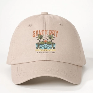 Detailed close-up of Salty Day beige cotton baseball cap with tropical palm tree embroidery