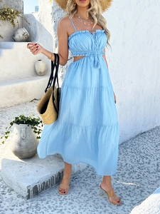 Detail of blue tiered ruffle hem and waist cutout design on a bohemian maxi dress