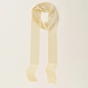 Detail of a golden metal mesh scarf with shimmering texture and long fringe tassels