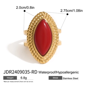 Detail view of gold woven ring with red oval stone showing dimensions and features