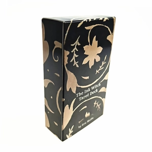 Detail view of The Ink Witch Tarot Deck box with gold floral patterns by Eric Maille