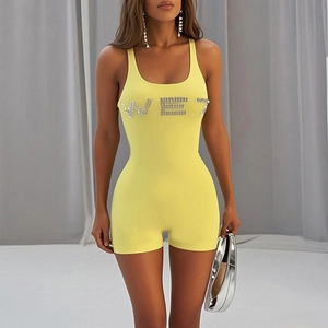 Detail of yellow tank bodysuit with rhinestone WET lettering and U-neck design