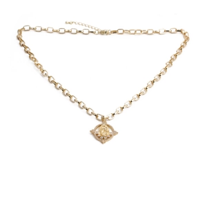 Detailed view of a gold-plated medallion pendant with religious icon and zircon stones