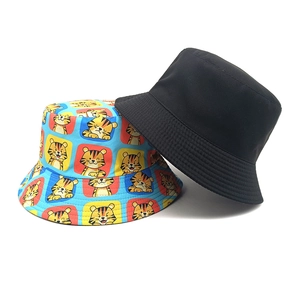 Double-sided reversible bucket hat with black and cartoon tiger pattern for outdoor travel