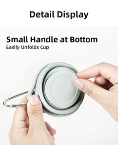 Detail of travel folding cup with bottom pull tab for easy expansion and metal carabiner