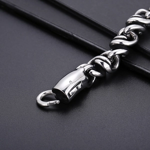 Detail view of the vintage spiral woven steel bracelet with its secure lobster clasp
