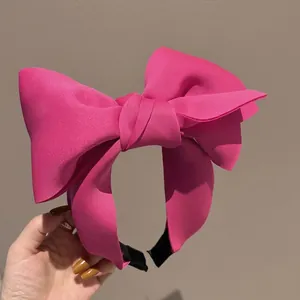Stereoscopic rose red oversized bow headband with premium textured fabric for women
