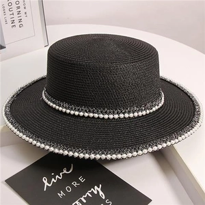 Chic black straw boater hat for women with elegant pearl trim and decorative hatband