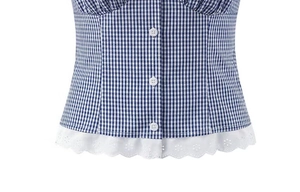Detailed view of blue gingham shirt fabric with white buttons and delicate lace hem
