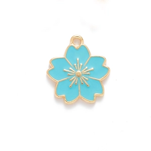 Close-up of sky blue cherry blossom enamel pendant with golden edges for DIY jewelry making