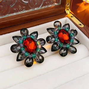 Vintage floral drop earrings with red center stone and multicolor gems in jewelry box