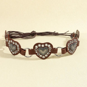 Detail of brown leather western belt with heart studs and metal eyelet lace-up design