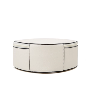 Close-up of cream white Saffiano leather round bag with contrasting black edge details
