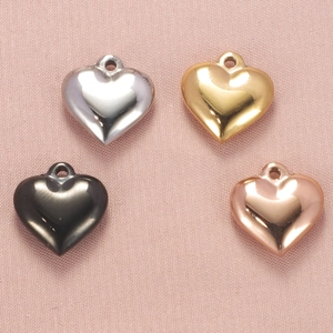 Polished heart-shaped stainless steel pendants in silver, gold, and rose gold finishes