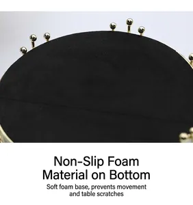 Detail of non-slip foam base on gold metal tray to protect tabletops from scratches