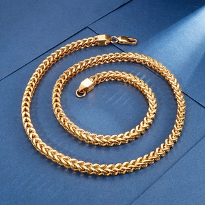 Macro shot of thick gold-plated Franco chain necklace with secure lobster clasp closure