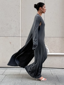 Detail of dark gray knitted long cardigan and slip dress set with side slit design