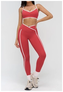 Detail of cross high-waisted yoga leggings and sports bra set with white contrast piping