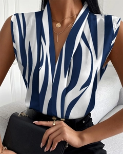 Detail view of women's V-neck sleeveless top with blue and white abstract zebra print