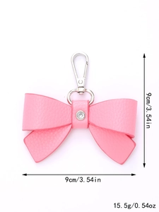 Detailed view of pink bow leather keychain with rhinestone and dimensions 9cm by 15.5g