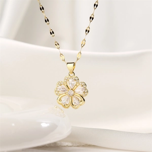 Close-up of golden flower pendant necklace with sparkling crystals and unique link chain