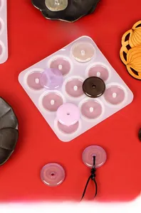Detail of 12-cavity silicone mold for making resin Chinese Ping'an Kou pendants