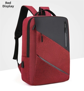 Detail view of red and black business backpack featuring an integrated USB charging port