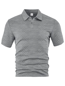Detail of grey polo shirt featuring premium jacquard texture and collar label