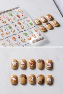 Macro detail of 5D embossed Chinese Zodiac nail stickers with 3D cute animal patterns