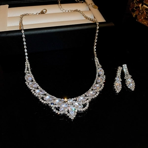 Macro view of luxurious teardrop jewelry set with sparkling crystals in a black gift box