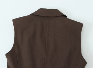 Detailed view of the back collar and shoulder tailoring of a dark brown suit vest