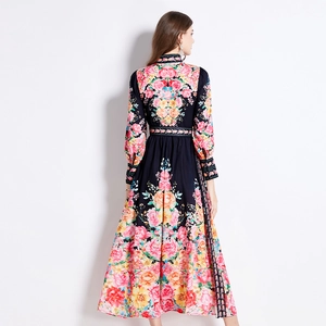 Floral navy blue maxi dress with long sleeves and pleated waist shown from the back view