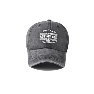 Front view of a dark grey washed cotton baseball cap featuring embroidered slogan text