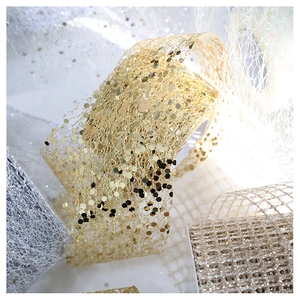 Close-up of glitter sequins on metallic chiffon ribbon for Christmas decoration