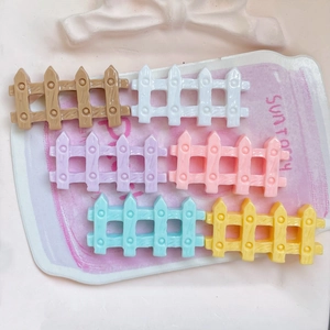 Set of 6 colorful glossy resin fence miniatures for DIY crafts on a pink background