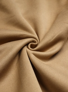 Macro shot of high-quality brown knit fabric texture and soft textile material detail