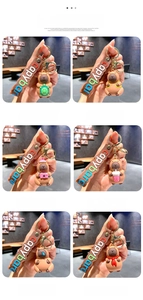Detail view of six cute Capybara keychain designs featuring PVC charms and leather straps