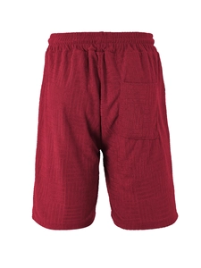 Detail view of red geometric jacquard texture shorts with elastic waistband and back pocket