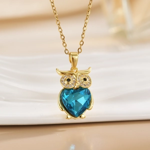 Golden owl necklace with heart-shaped blue crystal pendant and sparkling rhinestones