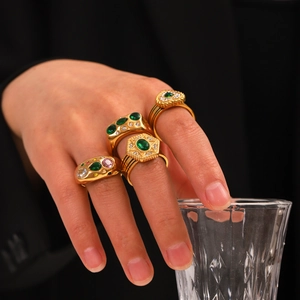 Gold stainless steel rings set with green zircon stones featuring star and heart motifs
