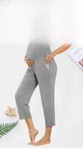 Detail view of high waist maternity leggings in grey with functional side pockets