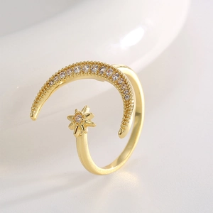 Chic 18K gold star and crescent moon open ring with sparkling cubic zirconia stones