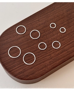 Detailed view of eight assorted sizes of S999 sterling silver minimalist hoop earrings